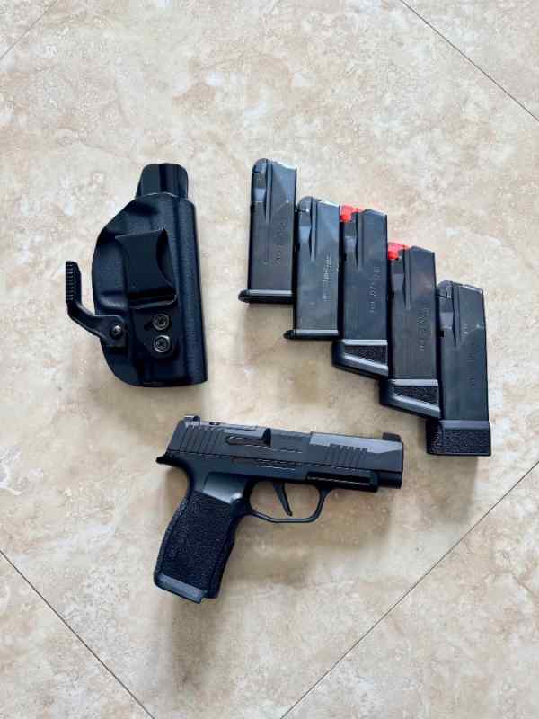 Sig P365XL with holster and magazines.